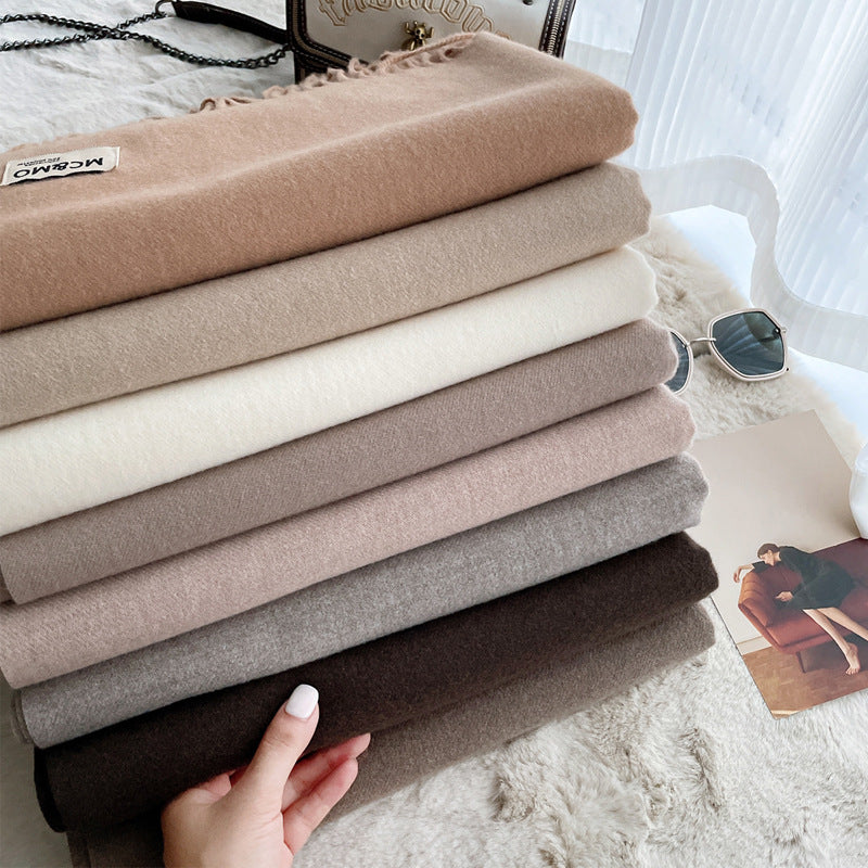 Lange sjaal met kwastjes in verschillende kleuren